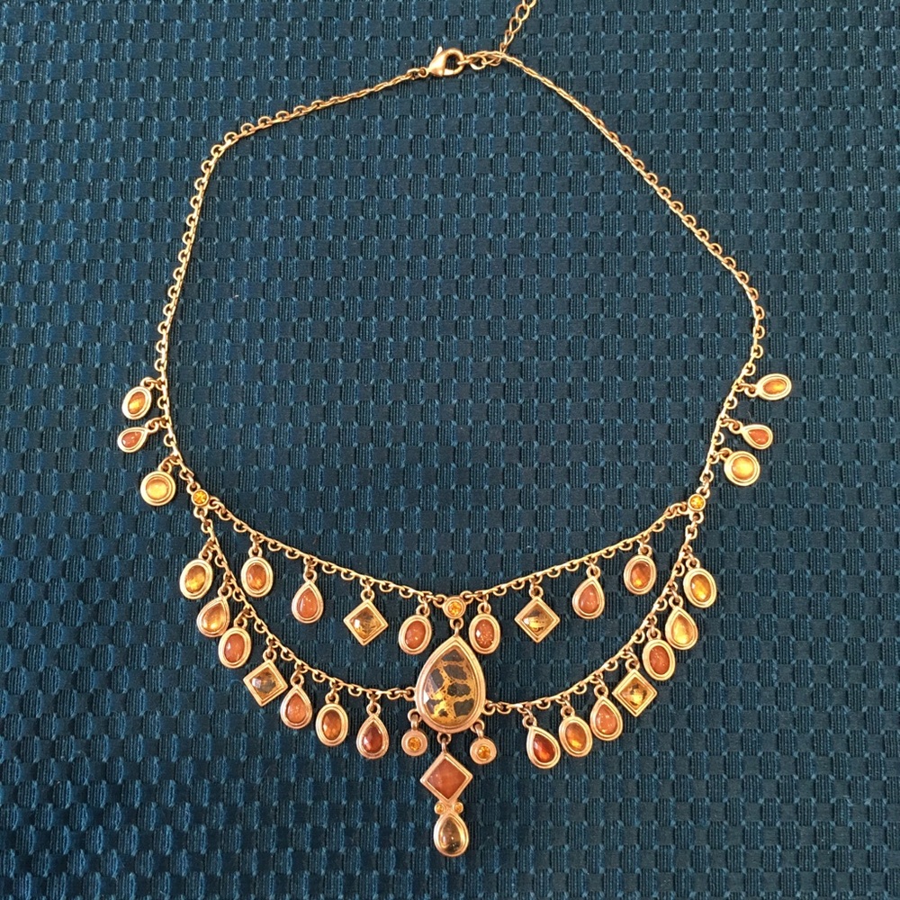 Choker necklace, gold and neutral tones.
